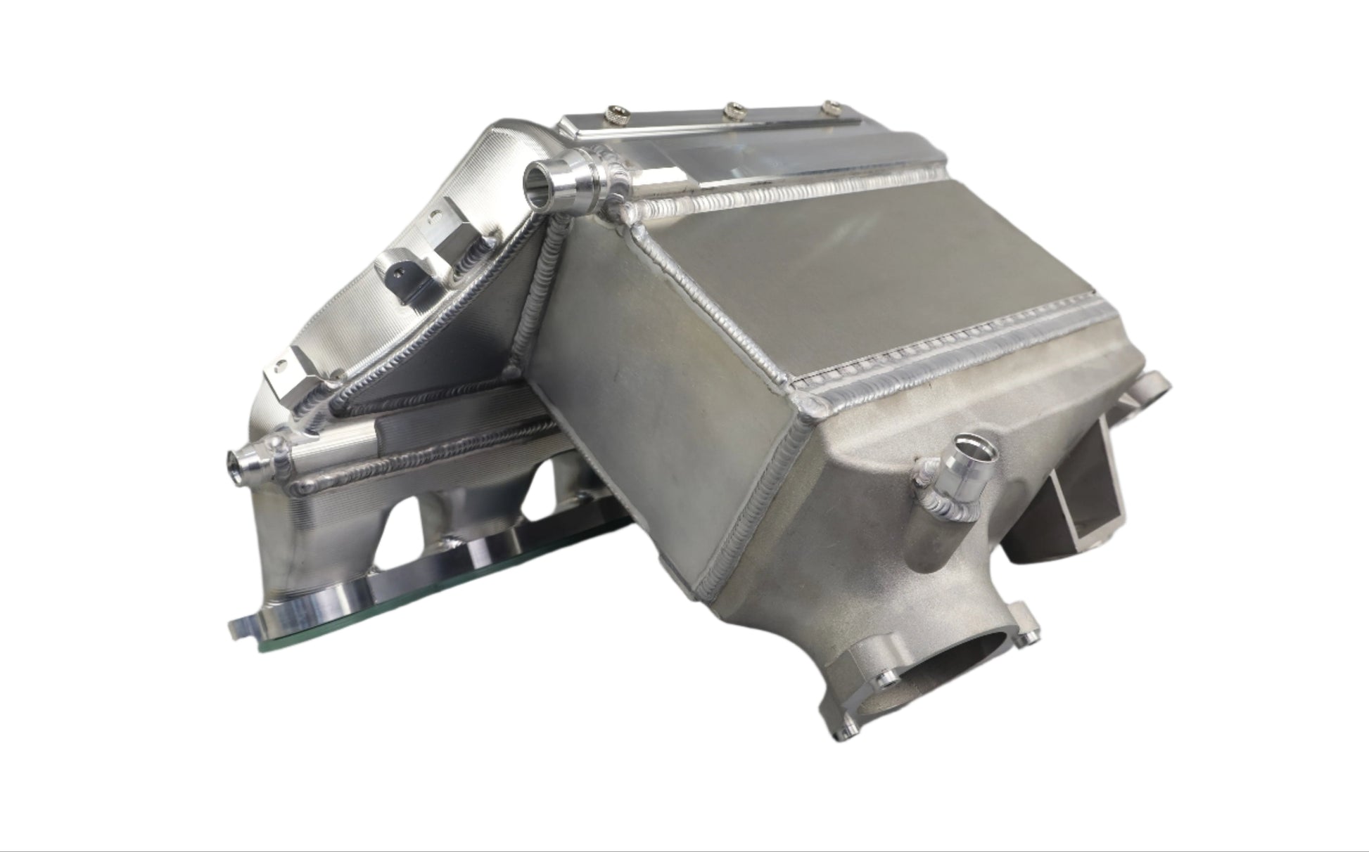 Metallic engine cover on a gray background