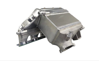 Metallic engine cover on a gray background