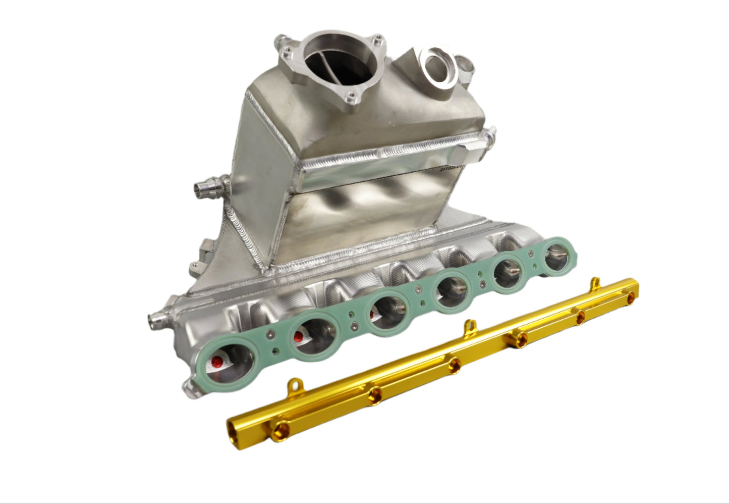 Metallic engine component with gaskets and a gold tool on a gray background