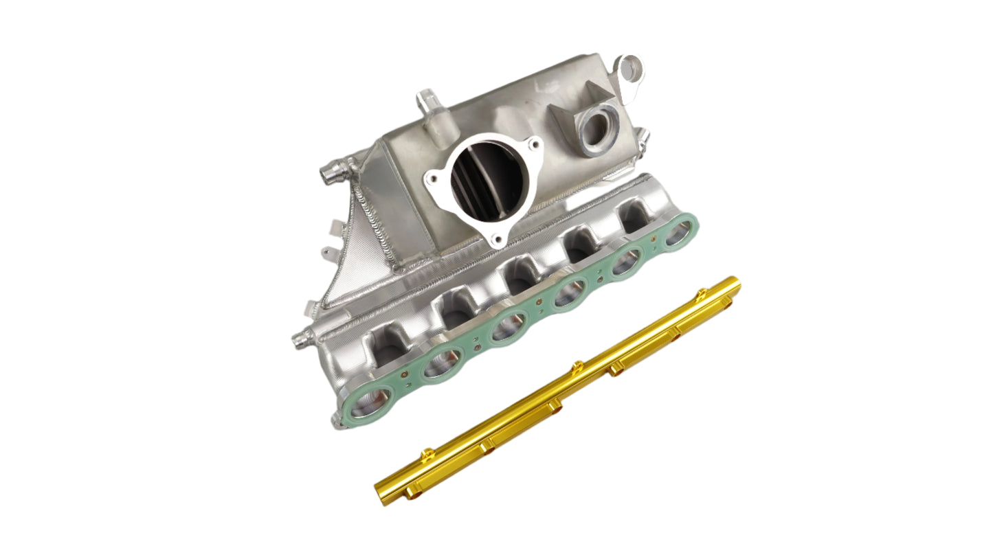 Metallic engine component with gasket and gold tool on a gray background